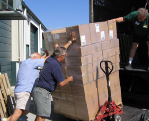 loading inland marine inflatable boat repair products into shipping truck